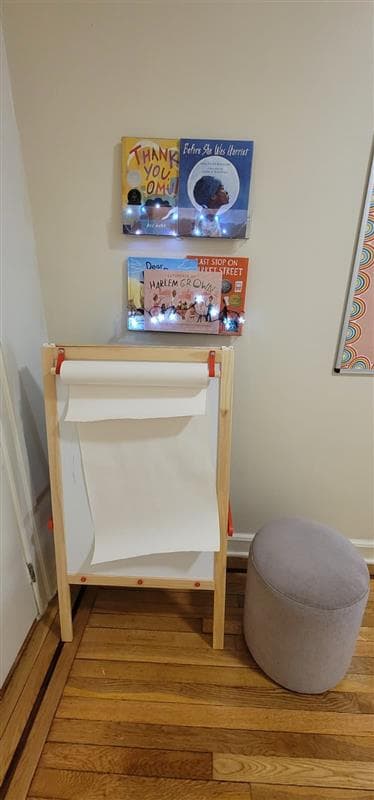Place To Grow reading corner with diverse children's books and a creative art easel